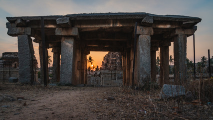 achyutaraya temple view from a door rock in hampi karnakata india at sunrise with cloudy sky