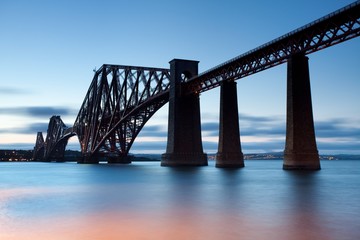 Rail Bridge over The Firth of Forth, crossing between Fife and Edinburgh at dusk, Scotland. morning scene, sunny day