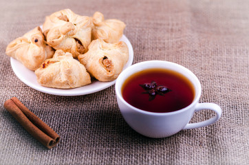 Apple patties on a background of burlap with coffee and cinnamon stick