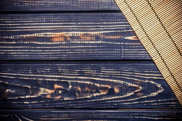 Linen tablecloth is a brown wooden table 