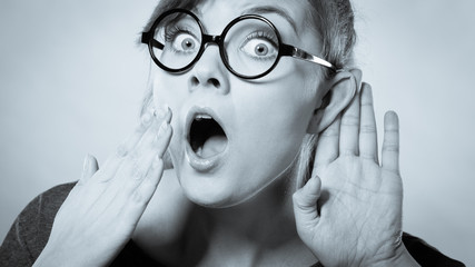 Shocked girl eavesdropping.