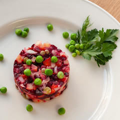 Vinaigrette of avocado, carrots, beets, sauerkraut, green peas and vegetable oil.
