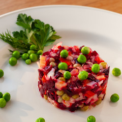 Vinaigrette of avocado, carrots, beets, sauerkraut, green peas and vegetable oil.