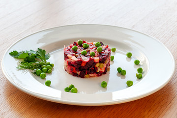 Vinaigrette of avocado, carrots, beets, sauerkraut, green peas and vegetable oil.