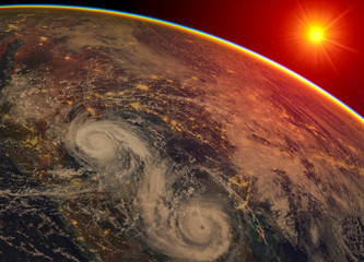 Hurricane visible above the earth, satellite view. Elements of this image furnished by NASA.