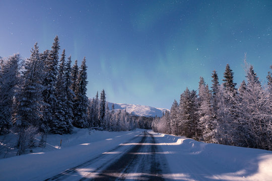 A road leading towards snow covered Pallas mountain at winter night in Pallas-Yll&auml;stunturi national park in Muonio Finland