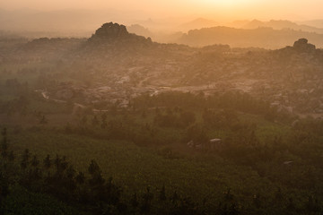 Fototapeta na wymiar hampi view from matanga hill at sunrise over the achyutaraya temple india karnakata mystical view