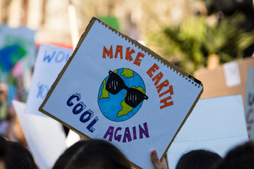 Protestors holding climate change banners at a protest