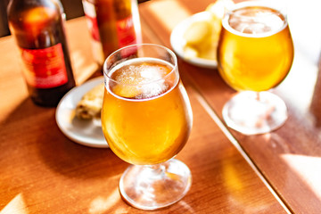 Glasses of cold beer with delicious tapas.