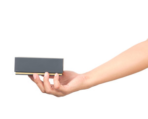Hand holding a gift box to deliver on isolated with clipping path.
