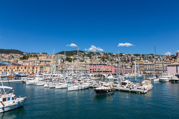 Fototapeta na wymiar Various yachts, boats and ships in the port of Genoa, Italy