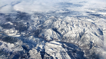 Stunning aerial view of snowy mighty mountains in Colorado.