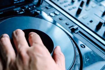Dj playing music at mixer