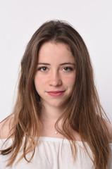 Naklejka premium young brunette woman on white background