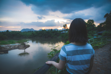 Fototapeta premium Happy young cute Asian Japanese girl hipster backpack women travelling looking at beautiful sky mountains scenery views 