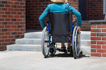 woman on wheelchair and stairs