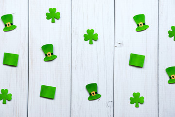 Happy St Patrick's Day. Craft paper decorations in form of leprechaun hat, flags and shamrock...