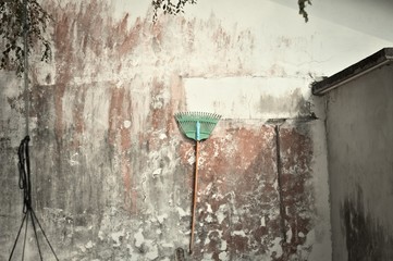Isolated rake hanging on the wall (Ari Atoll, Maldives)