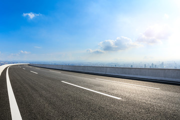 Fototapeta premium Empty asphalt road and modern city skyline with buildings in Shanghai,China