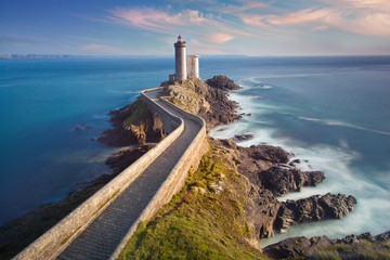 Petit Minou Lighthouse at sunset with red light , Brest , France View of Lighthouse of Petit Minou...