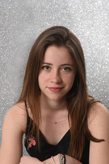 young brunette woman on a silver background