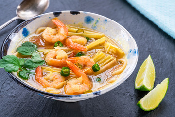 Tom yum - hot and sour Thai soup with prawns