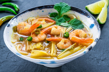 Tom yum - hot and sour Thai soup with prawns