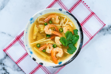 Tom yum - hot and sour Thai soup with prawns