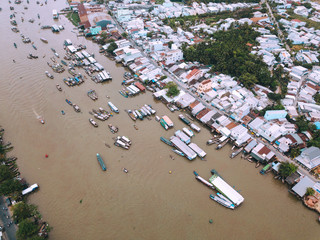 Traditional culture floating market at Cai Rang floating market, Can Tho, Vietnam. Aerial view, top view panoramic of floating market with tourist travel, local people buy and sell on boats, ships