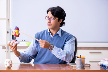 Young lecturer teacher teaching anatomy