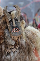 Pernik, Bulgaria - January 27, 2019 - Masquerade festival Surva in Pernik, Bulgaria. People with mask called Kukeri dance and perform to scare the evil spirits.