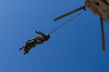 Special Forces descend on a rope