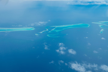 Fototapeta na wymiar Maldives from the Sky with the blue sea and white sand and beach in the indian ocean