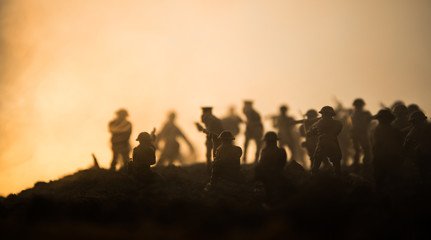 War Concept. Military silhouettes fighting scene on war fog sky background, World War Soldiers Silhouettes Below Cloudy Skyline At night. Attack scene. Armored vehicles. Tanks battle. Decoration