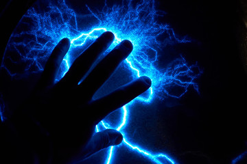 Electric plasma ball on a dark background. Static electricity model