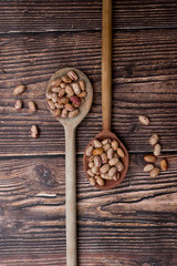 Organic Colorful Beans on Dark Wooden Background