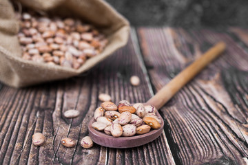 Organic Colorful Beans on Dark Wooden Background