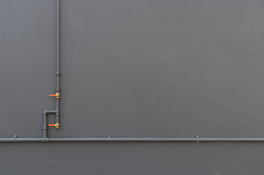 closeup water pipe install on brick wall background