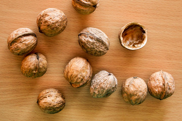 Walnuts are scattered on the kitchen table.