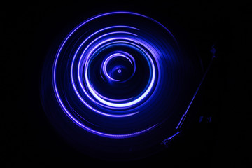 Concept of speed - Trail of fire and smoke - Vinyl record. Burning vinyl disk. Turntable vinyl record player. Retro audio equipment for disc jockey. Sound technology