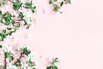Flowers composition. Apple tree flowers on pastel pink background. Spring concept. Flat lay, top view, copy space