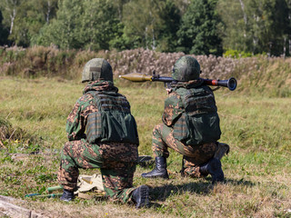 A soldier shoots an RPG-7
