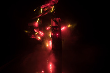 Image of a time bomb against dark background. Timer counting down to detonation illuminated in a shaft light shining through the darkness,