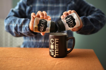 child with cup of coffee with pepper and salt, joke