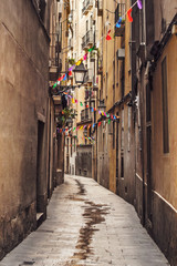 Narrow street in the old city of Barcelona
