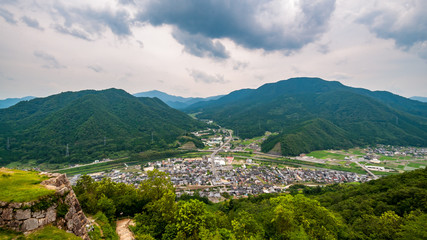 Fototapeta na wymiar Photo of the panoramic view taken from the top of Takeda Castle Ruins located in Hyogo Prefecture's Asago City in Japan, which is a famous and popular side trip from nearby Himeji.