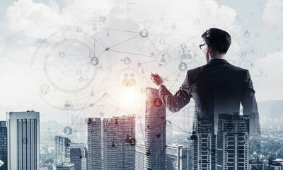 Concept of business success and control with confident boss against cityscape background