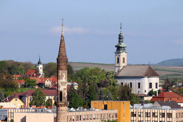 minaret and churches different religions in one city Eger Hungary