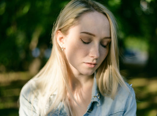 Outdoors portrait of beautiful young woman. Selective focus.