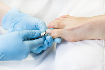 Process of pedicure at beauty salon